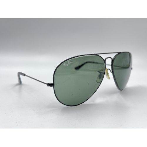 2297 - A cased pair of Ray-Ban Aviator sunglasses