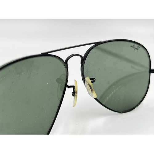 2297 - A cased pair of Ray-Ban Aviator sunglasses