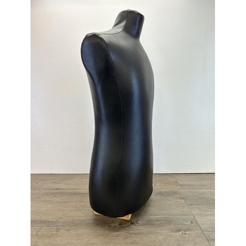 462 - A black leather mannequin torso - approx. 80cm high