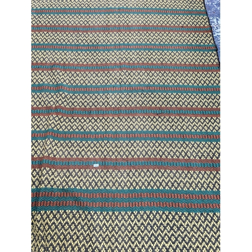 486 - A mid 20th century hand woven tasselled throw - approx. 233cm x 130cm