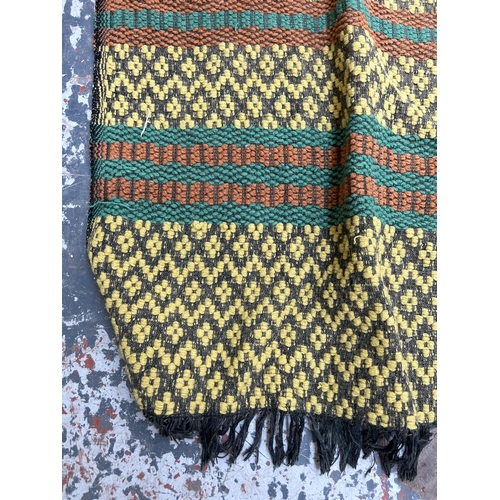 486 - A mid 20th century hand woven tasselled throw - approx. 233cm x 130cm