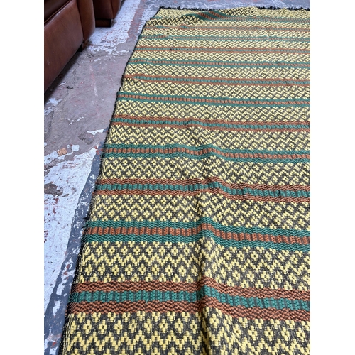 486 - A mid 20th century hand woven tasselled throw - approx. 233cm x 130cm