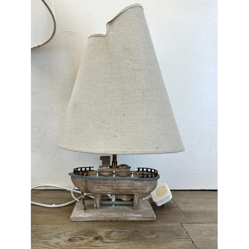 502 - Two The Range nautical table lamps, one rope and one boat - largest approx. 64cm high