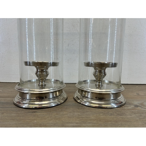 503 - A pair of Laura Ashley glass and silver metal cylinder Hurricane lamps - approx. 28cm high