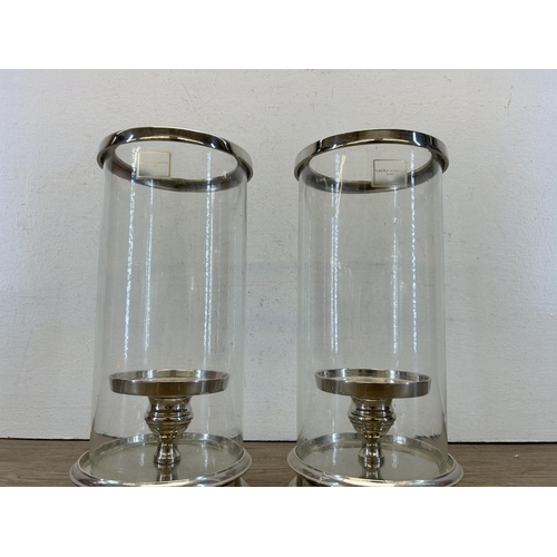 503 - A pair of Laura Ashley glass and silver metal cylinder Hurricane lamps - approx. 28cm high