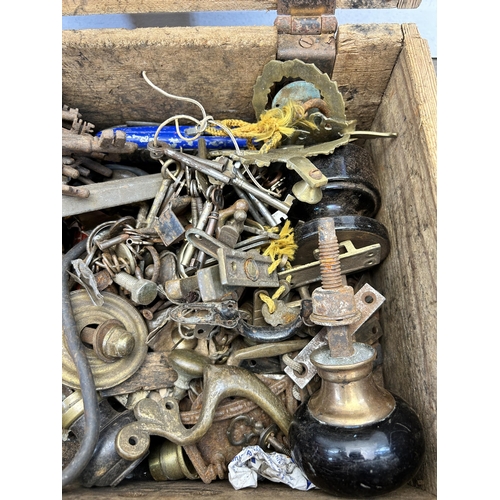 519 - A 19th century pine toolbox containing a large collection of keys and door furniture