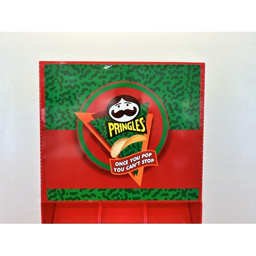 521 - A Pringles plastic advertising display stand - approx. 54cm high x 32cm wide x 18cm deep