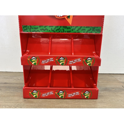 521 - A Pringles plastic advertising display stand - approx. 54cm high x 32cm wide x 18cm deep