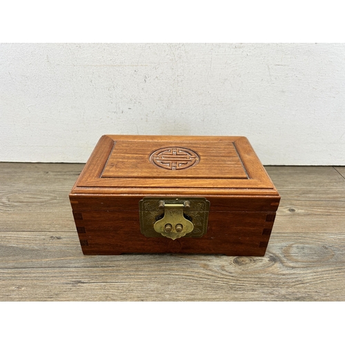 527 - A Chinese carved hardwood and brass jewellery box - approx. 10cm high x 22cm wide x 15cm deep