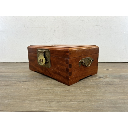 527 - A Chinese carved hardwood and brass jewellery box - approx. 10cm high x 22cm wide x 15cm deep