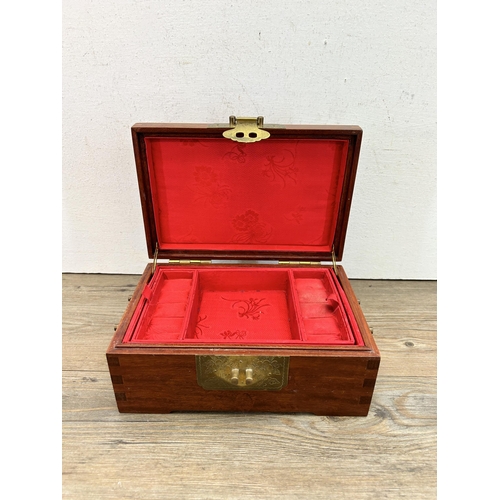 527 - A Chinese carved hardwood and brass jewellery box - approx. 10cm high x 22cm wide x 15cm deep