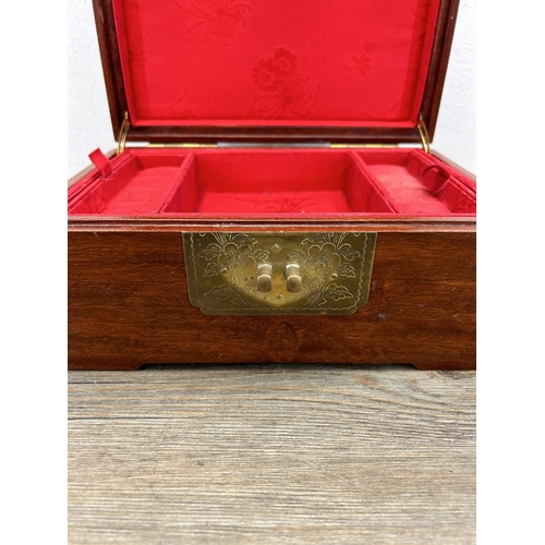 527 - A Chinese carved hardwood and brass jewellery box - approx. 10cm high x 22cm wide x 15cm deep