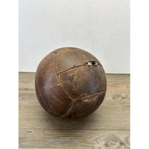 538 - A mid 20th century brown leather football