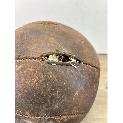 538 - A mid 20th century brown leather football