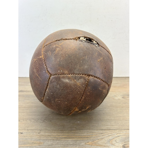 538 - A mid 20th century brown leather football