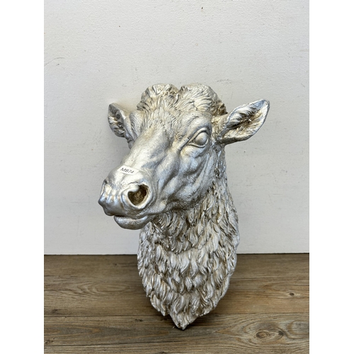 550 - A silver painted cow head wall plaque - approx. 46cm high