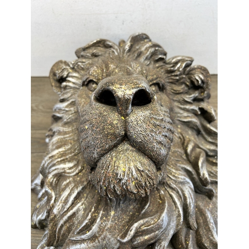 552 - A silver painted lion head wall plaque - approx. 48cm high