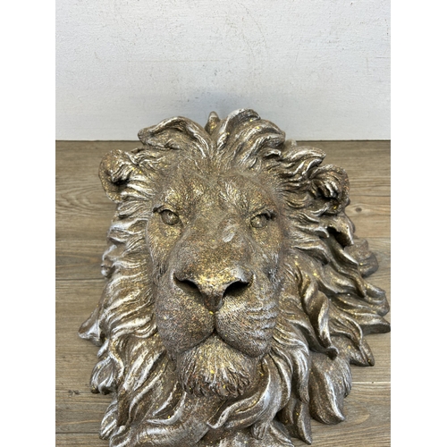 552 - A silver painted lion head wall plaque - approx. 48cm high