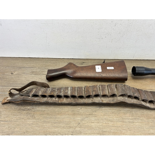 557 - Three items - Viking 4x32 rifle scope, mahogany rifle stock and brown leather gun holster