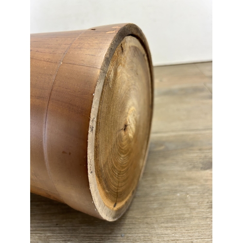 558 - A yew wood cylindrical stick stand with two umbrellas - approx. 59cm high x 20cm diameter