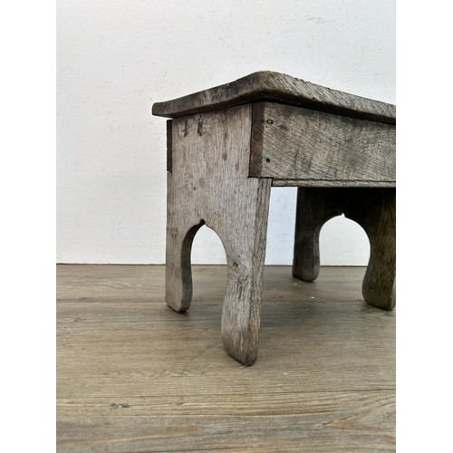 530 - A late 19th/early 20th century oak farmhouse stool - approx. 27cm high x 30cm wide x 22cm deep