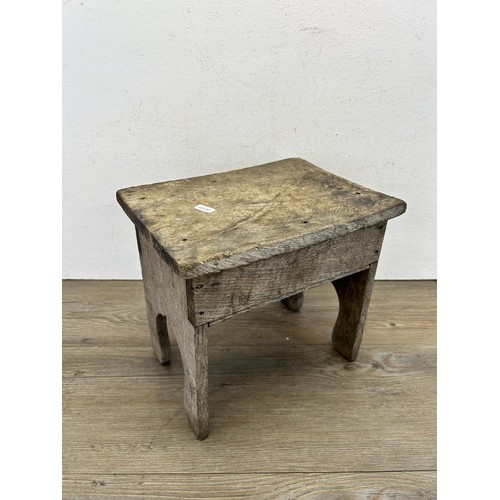 530 - A late 19th/early 20th century oak farmhouse stool - approx. 27cm high x 30cm wide x 22cm deep