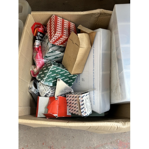 897 - Five boxes containing clothing, boxed Stikatak knee kicker, sand paper, O rings etc.