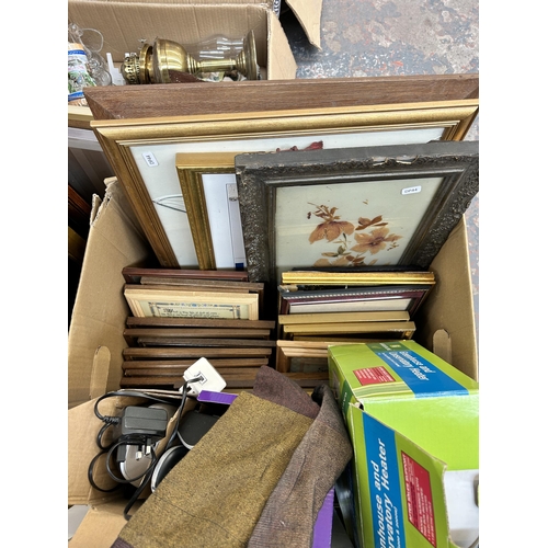 921 - A collection of house clearance items to include boxed Parasene greenhouse heater, framed pictures a... 