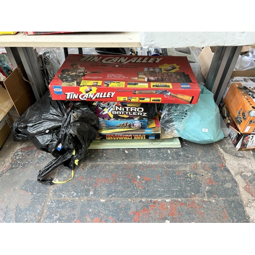 930 - A large collection of vintage and modern toys and games to include boxed Ideal tin can alley, boxed ... 