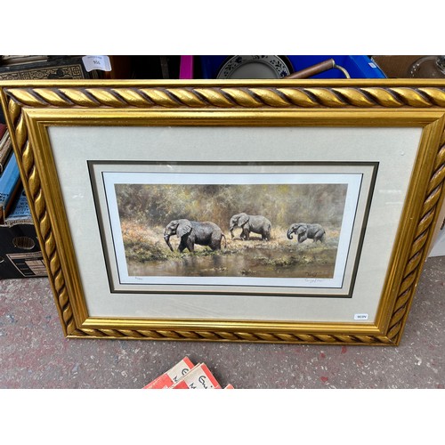 916 - Two boxes containing two framed David Shepherd prints - one being pencil signed, antique leather bou... 