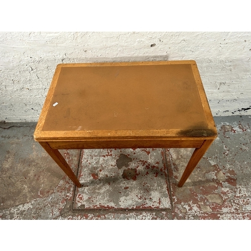 199 - A 1960s Remploy oak writing table - approx. 76cm high x 83cm wide x 52cm deep