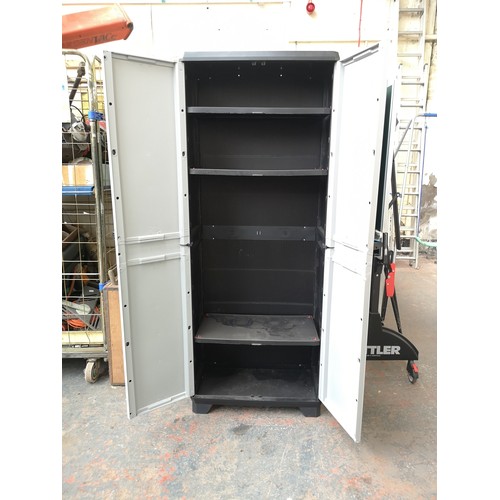 772 - A plastic two door storage unit with three internal shelves - approx. 173cm high x 68cm wide x 38cm ... 