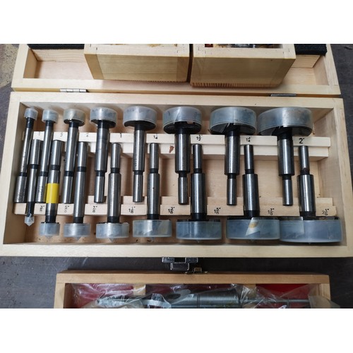 864 - Four cased drill bit sets