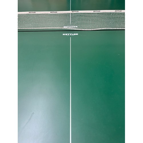 752 - A Kettler folding table tennis table with net, paddles and balls