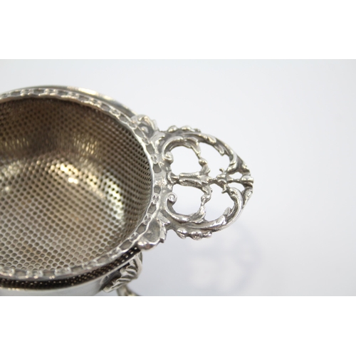 2257 - A Mappin & Webb hallmarked Birmingham sterling silver tea strainer and stand, dated 1971 - approx. g... 