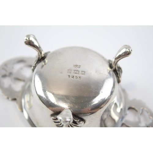 2257 - A Mappin & Webb hallmarked Birmingham sterling silver tea strainer and stand, dated 1971 - approx. g... 