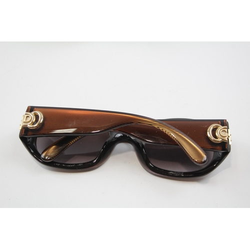 2334 - A cased pair of Christian Dior sunglasses