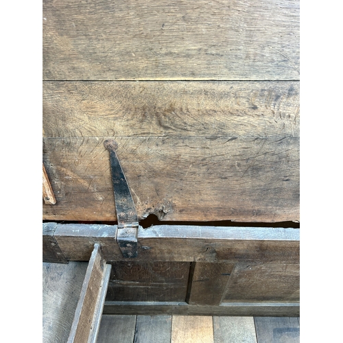 185 - A Georgian oak three panel coffer - approx. 63cm high x 136cm wide x 52cm deep