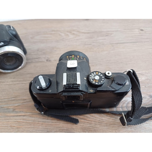 Two cameras, one Chinon CM4 35mm SLR and one Kodak PixPro AZ252 16mp digital bridge camera