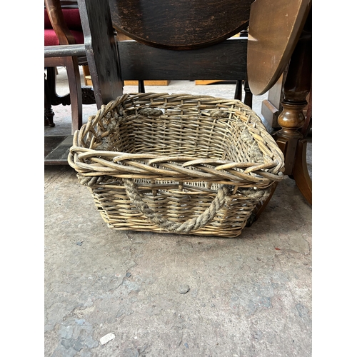 12 - Three pieces of furniture, wicker basket with rope handles, Edwardian mahogany oval two tier side ta... 