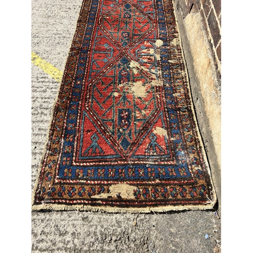 121 - A Persian hand knotted hall runner - approx. 285cm x 77cm