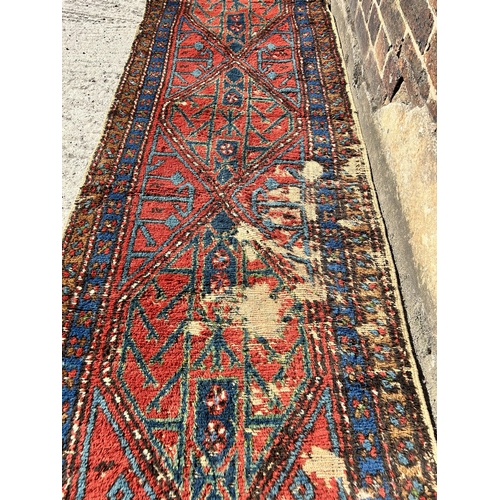 121 - A Persian hand knotted hall runner - approx. 285cm x 77cm