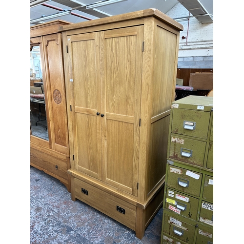 143 - A modern oak double wardrobe - approx. 192cm high x 100cm wide x 60cm deep