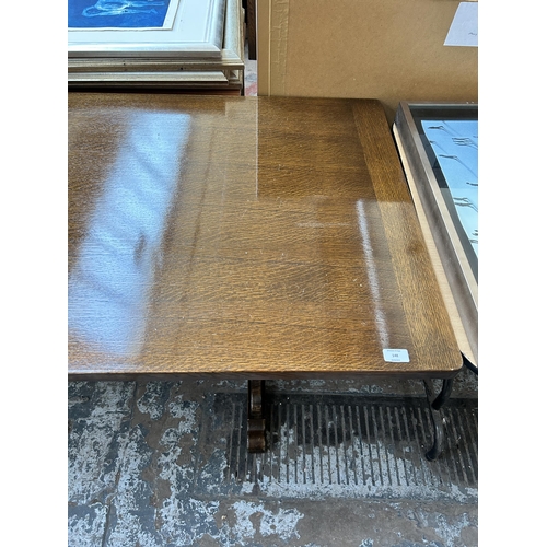 148 - An oak rectangular trestle dining table