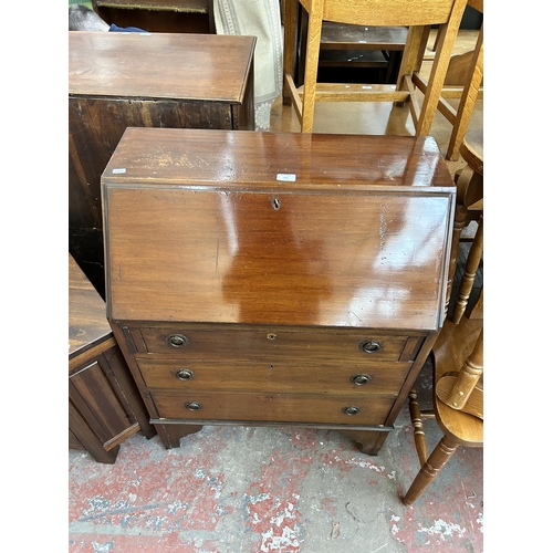 156 - An Edwardian mahogany bureau on bracket supports