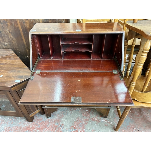 156 - An Edwardian mahogany bureau on bracket supports