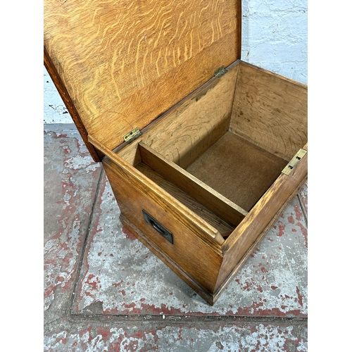 18 - A Victorian oak blanket box with brass handles - approx. 35cm high x 63cm wide x 39cm deep