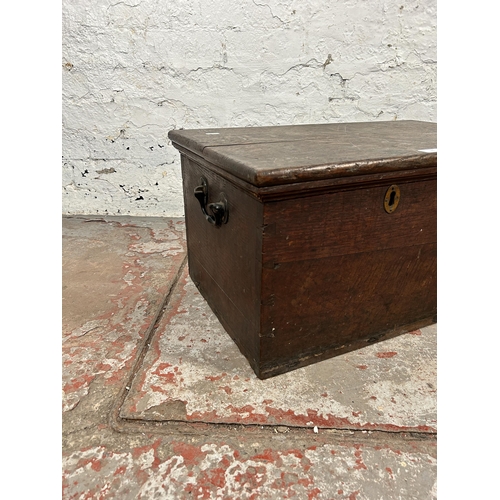 21 - A 19th century oak blanket box with black painted cast iron handles - approx. 32cm high x 63cm wide ... 