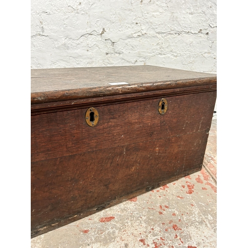 21 - A 19th century oak blanket box with black painted cast iron handles - approx. 32cm high x 63cm wide ... 