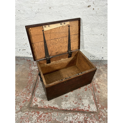 21 - A 19th century oak blanket box with black painted cast iron handles - approx. 32cm high x 63cm wide ... 